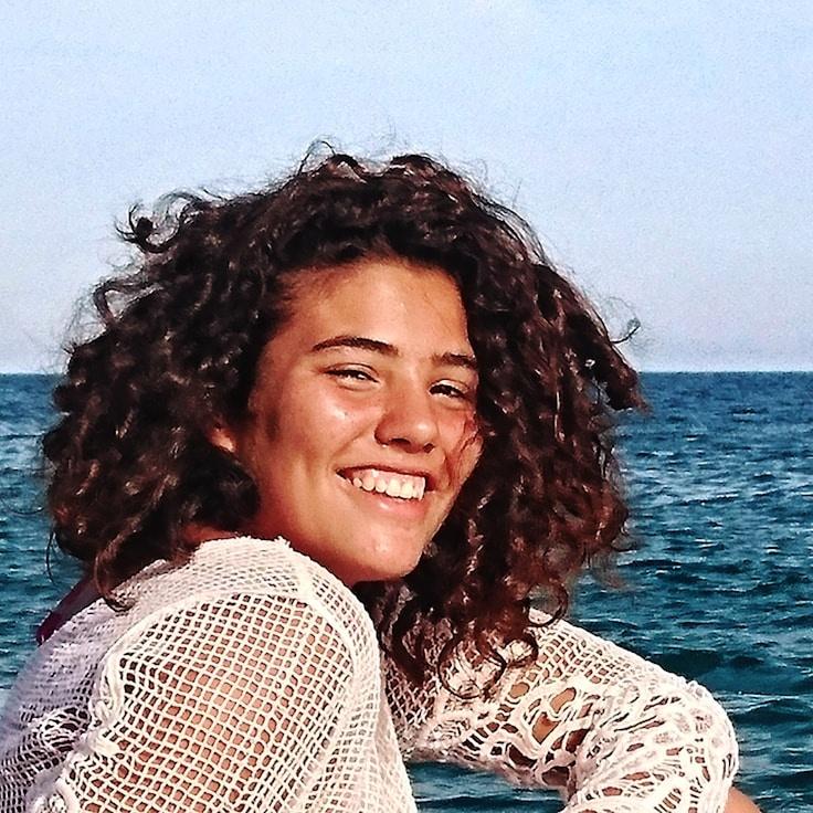 Kaveri Mehta, Lead Design Curator at Distributed Network Solutions, reviewing corporate floral arrangements